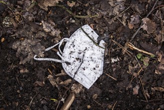 Discarded FFP2 masks lying in nature