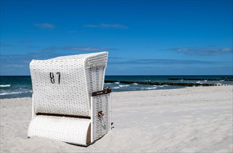Single beach chair on the sandy beach of Ahrenshoop