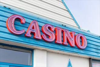 Red sign for casino on seafront