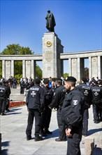 A police detachment in front of the Soviet Memorial on the Strasse des 17. Juni