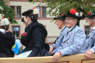 Participants in the Oktoberfest Tentowners' and Brewery Parade pass by at the start of the event. Munich
