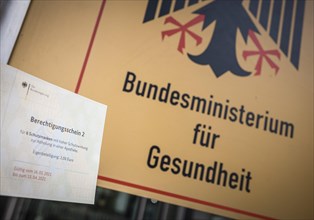 Certificate of entitlement for six FFP2 high protection masks to be collected from a pharmacy. Recorded in front of the Federal Ministry of Health in Berlin