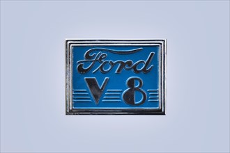 Blue vintage Ford V8 logo