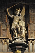 Statue of Archangel Michael slaying a dragon at Mont Saint-Michel