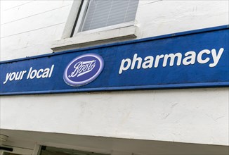 Boots Your Local Pharmacy sign outside chemist shop