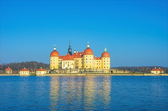 Exterior view of Moritzburg Castle in winter with half-frozen castle pond from the southwest