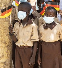 Children wearing nose-mouth protection in a school in Africa