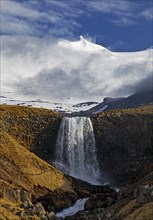 The Snaefellsjoekull with the Svoedufoss waterfall