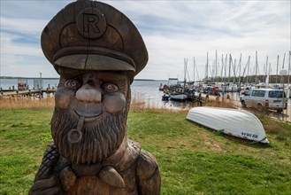 Wooden sculpture Fisherman Erik of Rerik at the harbour