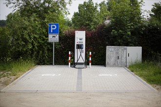 Free charging places at a charging station for electric vehicles in the green. Ummanz