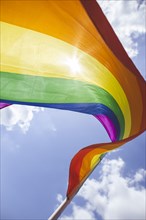 A rainbow flag waves