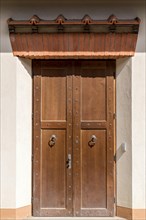 Entrance door with reconstructed lintel