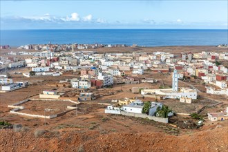 Oblique view over coastal town to Atlantic Ocean