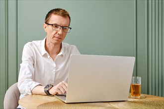 Middle aged entrepreneur owner of small business working online from home