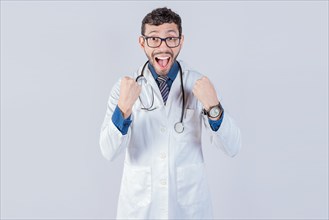 Young doctor is happy celebrating something