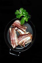 Bacon strips in pans