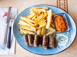 Typical local cevapcici grill plate