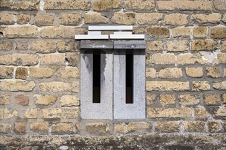 Mailboxes integrated into a brick wall