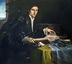 Portrait of a young man with a book in his study