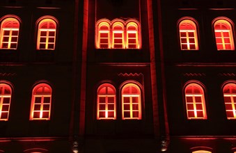 Red-lit windows