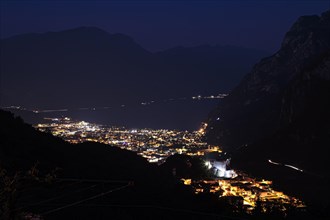 The town of Riva del Garde at night on Lake Garda in the municipality of Riva del Garda Trentino Northern Italy Europe