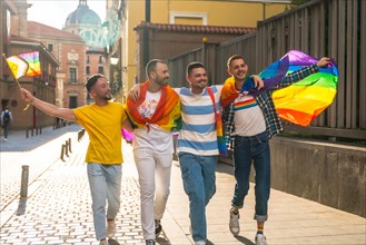 Couples of men having fun at the demonstration with the rainbow flags