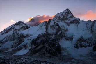 Nuptse in the foreground and Mount Everest at dawn during a trekking tour to Everest Base Camp