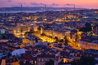 Evening aerial view of Lisbon famous view from Miradouro da Senhora do Monte tourist viewpoint of Alfama and Mauraria old city districts