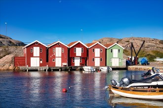Fishing boats and colourful boathouses in the harbour of Smögen