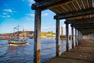 Historic ship in the harbour entrance of Whitby