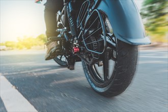 Low angle view of a motorcyclist riding motorcycle