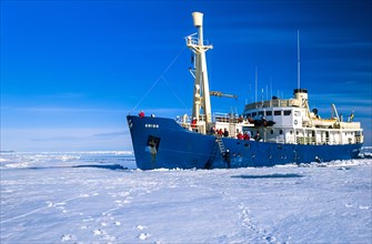 Ship with tourist at the ice edge in arctic