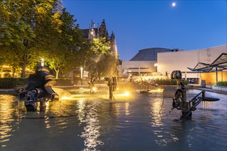 The Fasnacht Fountain or Tinguely Fountain on Theaterplatz in Basel at dusk