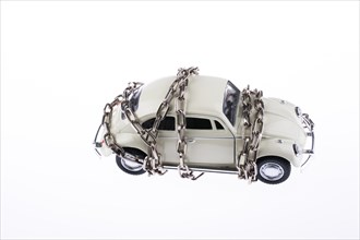 Chained white car on white background