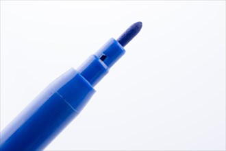 Felt-tip pen of blue color on a white background