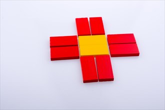 Colorful Domino Blocks forming a Sun shape on a white background