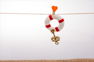 Life preserver attached to a string with heart icon