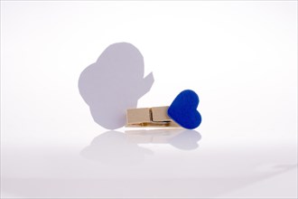 Speech buble clipped with clothespin on a white background