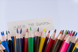 Color Pencils and back to school title on a white background