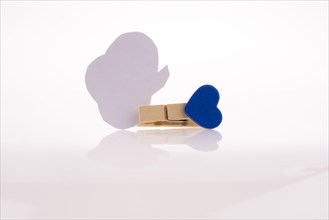 Speech buble clipped with clothespin on a white background