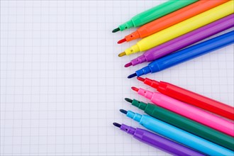Colorful felt-tip pens on a notebook