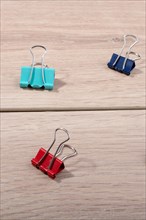 Picture of metallic binder clips with handles in view
