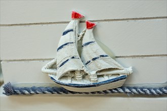 Mini size little colorful model sailboat in view