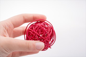 Roll of colotful string in the hand