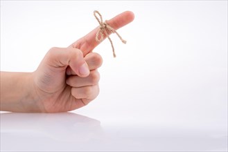 Hand tied with a thread like a ribbon on a white background