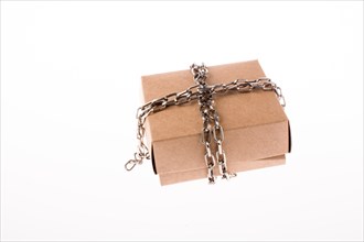 Cardboard Box in chains on a white background