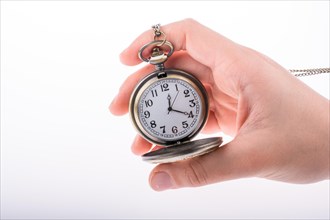 Hand holding a retro styled pocket watch in hand