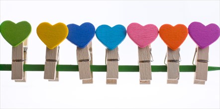 Colorful clothespin attached attached on a line side by side