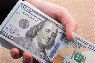 Close up of Benjamin Franklin face on 100 US dollar bill