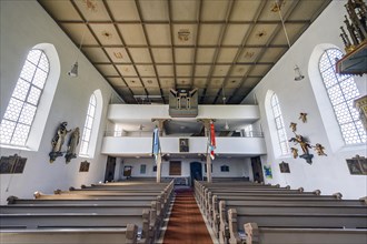 The organ loft of the Church of St Michael with coffered ceiling and flags